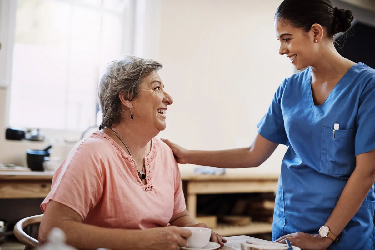 An adult-gerontology nurse practitioner interacts with her patient.