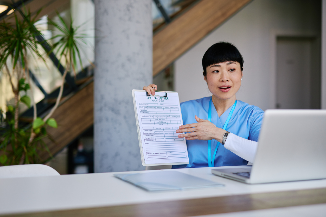 A Nurse Conducts a Telehealth Video Call Using a Laptop..jpg
