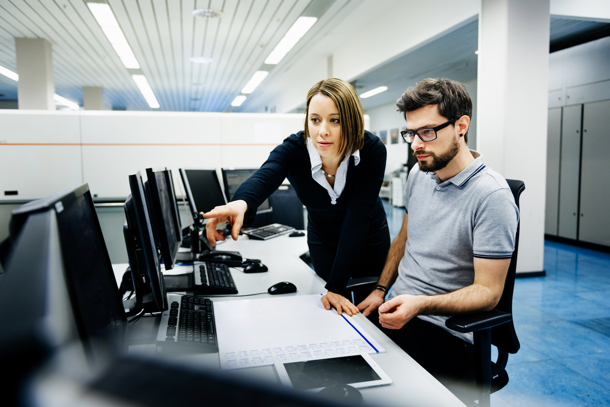 Cybersecurity Professionals Work in a Control Room With Multiple Computer Monitors.