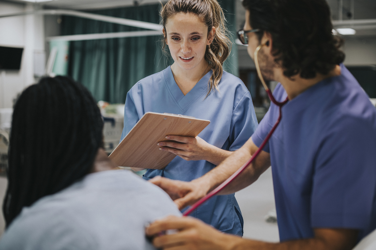 A Nursing Student Takes Some Patient Information as Part of a Clinical Rotation..jpg