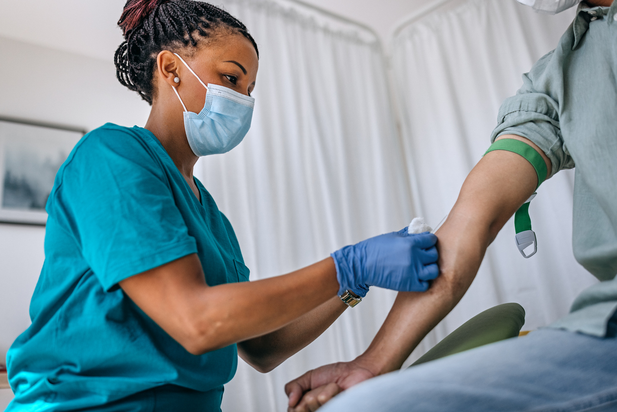 A Global Health Nurse Taking a Blood Sample From a Patient.